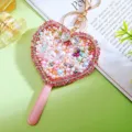 Detailed view of sparkling rhinestone heart makeup mirror keychain and cute bag pendant. - A943 Heart Lollipop Mirror Pearl Style