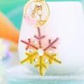 Rhinestone snowflake keychain detail, cute pink and gold crystal bag pendant accessory. - Single OPP Bag Packaging / A820 Rhinestone Snowflake Pink Yellow Gradient