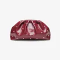 Burgundy pleated clutch bag detail, soft leather with chic gold tone metal studs design. - Burgundy