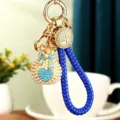 Metal rhinestone pearl money bag keychain cute car key ring charm and bag pendant. - Woven Rope Pearl Heart Lucky Bag / Sky Blue