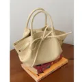 Borsa secchiello da donna color crema con grazioso fiocco, elegante borsetta per uso quotidiano. - Giallo latte
