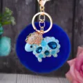 Blue fluffy sheep keychain detailed view, cute plush pom-pom bag charm with rhinestone crystals. - Blue Rhinestone Sheep + Royal Blue Plush Ball