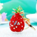 Close-up detail of the sparkling red rhinestone pineapple keychain with gold hardware. - Single OPP Bag Packaging / Red