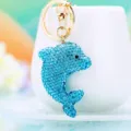 Blue rhinestone dolphin keychain with gold keyring, cute metal bag charm and car key accessory. - A788 Clay Rhinestone Dolphin Blue