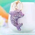 Close-up detail of a sparkling purple rhinestone dolphin keychain pendant hanging securely. - A788 Clay Rhinestone Dolphin Purple