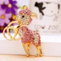 Rhinestone crystal goat keychain detail view, sparkling pink and white gems on gold metal. - Pink Goat
