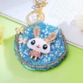 Detailed view of a cute rhinestone rabbit mirror keychain with pearls and blue gems. - Single OPP Bag Packaging / Blue