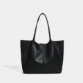 Black minimalist tote bag detail, large capacity single shoulder commuter daily use. - Black