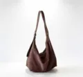 Detailed view of the brown suede hobo shoulder bag showing soft texture and adjustable strap. - 46*28*32cm / Coffee
