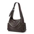 Detailed view of the dark brown hobo shoulder bag with stylish slouchy design and side pockets. - Coffee