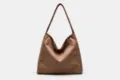 Brown suede shoulder tote bag detail view, showing the soft texture and large capacity style. - Coffee Zipper Style