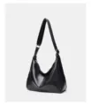 Black soft leather shoulder bag detail showing adjustable strap and slouchy hobo design. - 31*11*27CM / Black