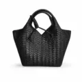 Detailed view of the black woven leather handbag showcasing exquisite intrecciato texture details. - Black