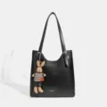 Classic black tote bag for women, large capacity shoulder bag with cute rabbit doll pendant. - Black