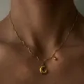 Detail shot of 18k gold plated stainless steel wavy chain necklace with puffy letter C pendant. - Letter C