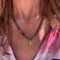 Multicolored beaded necklace with gold pendant detail, stylish daily neck ornament for women. - Letter I