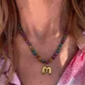 Colorful beaded necklace with gold letter pendant, stylish fashion jewelry for daily wear. - Letter M