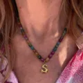 Colorful beaded necklace detail featuring a stylish gold letter S pendant for daily wear. - Letter S