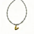 Stainless steel beaded necklace with gold puffy letter pendant, fashion clavicle jewelry detail. - Letter V
