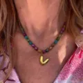 Colorful beaded necklace with gold letter V pendant trendy fashion jewelry for daily wear. - Letter V