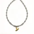 Detail shot of stainless steel bead necklace with gold bubble letter pendant, chic clavicle chain. - Letter Y