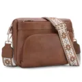 Brown leather crossbody bag for women with wide patterned strap and multiple zipper pockets. - Tan