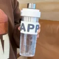 Clear plastic water bottle with straw and silicone sleeve, ideal for fitness, sports and office use. - 650ml / White