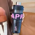 Ergonomic Tritan sport water bottle with pink silicone sleeve and secure metal lid for gym. - Large Capacity / Black