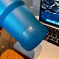Tyeso stainless steel tumbler with silicone protective boot base detail shot showing branding. - Diameter 71-75mm / Deep Lake Blue