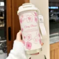 Portable stainless steel vacuum insulated tumbler with cherry blossom pattern and strap. - Cherry Blossom White