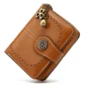 Brown vintage women short leather wallet with zipper buckle, hollow floral design and charm. - Tan
