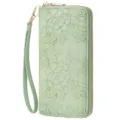 Detailed view of the elegant embossed floral texture, premium vegan leather and sturdy gold zipper. - Embossed Light Green