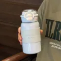 Portable minimalist dual-drink stainless steel insulated water bottle with cute sleeve for students. - Blue