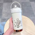 White stainless steel thermos bottle variant featuring a delicate lily of the valley design. - White