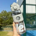 Grey portable sports water bottle with straw, stylish plastic cup for outdoor and daily use. - Single Cup / Gray 695ML