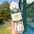 Large capacity portable sports water bottle with straw and silicone sleeve for outdoor use. - Single Cup / White 695ML