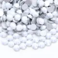 Close-up detail of white iridescent glass flatback rhinestones for nail art and DIY phone cases. - Starlight Porcelain White