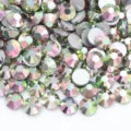 Detailed view of colorful glass flatback rhinestones for DIY nail art and crafts. - Starry Pink