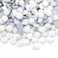 Close-up detail of shimmering multi-color flatback glass rhinestones for DIY crafts and nail art. - Mother Of Pearl