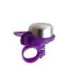 Close-up of a purple and silver mini bicycle bell, thumb lever design for mountain bikes. - Purple