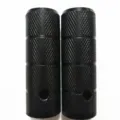 Close-up detail of black steel bicycle stunt pegs featuring anti-slip knurled pattern. - 38mm / Black
