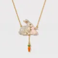 Close-up detail of the cute enamel bunny and carrot pendant necklace with gold chain finish. - Mother-Child Rabbit Necklace