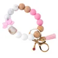 Stijlvolle siliconen houten kralen sleutelhanger armband met roze lotus bedel en kwastje variatie - Polsband Stijl / Roze Polsband