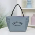 Stylish grey waterproof canvas tote bag with rope handles and large capacity for daily commute. - Gray-Purple Double-Sided
