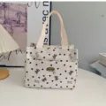 Cute black heart bow print canvas handbag with front pocket and double handles for daily work. - Bow Off White