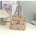 Canvas handbag with cute bow and heart print, stylish commuter tote bag for daily lunch or work. - Khaki Bow