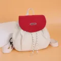 Casual color block backpack for women, stylish canvas school bookbag with drawstring closure. - Red