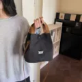 Korean style cartoon embroidered canvas handbag casual crossbody bucket bag for daily use. - Black