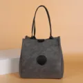 Stylish grey tote bucket bag for women, versatile shoulder handbag with top handles and classic design. - Gray