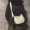 Minimalist white canvas crossbody bag with cute green frog pendant, casual shoulder sling bag. - White With Pendant